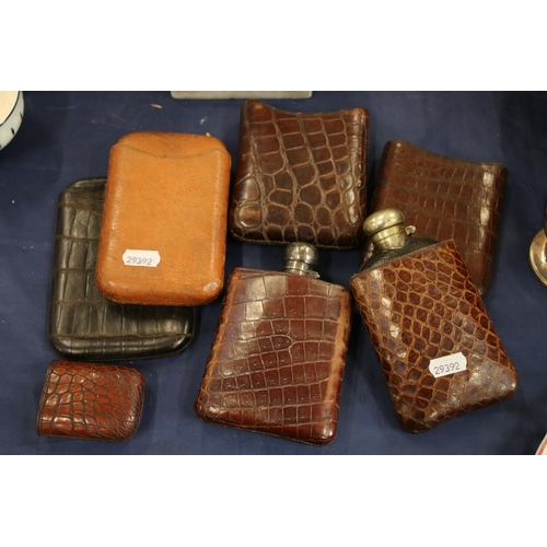 196 - Hip flasks, crocodile skin hip flask cases and cigar cases.