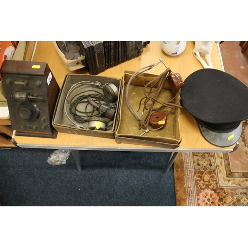 214 - 1920s 'Re-Echol' crystal radio set with headsets and a peak cap.