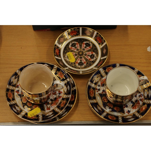 218 - Royal Crown Derby Imari saucer #1128 and two older Imari cups and saucers.