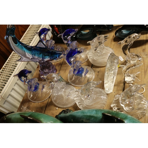 97 - Glass dolphin models.