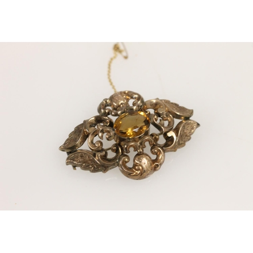 513 - Victorian base metal brooch with central citrine stone, W6.1cm