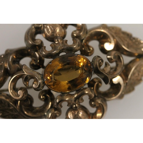 513 - Victorian base metal brooch with central citrine stone, W6.1cm