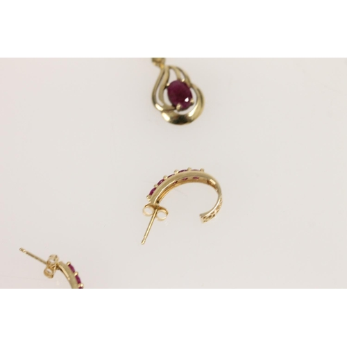 514 - Pair of 14ct and ruby earrings together with a yellow metal and oval ruby pendant, gross 3.3g