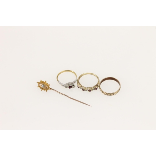 525 - Three yellow metal rings together with a 9ct gold hallmarked stick pin, gross 7.3g