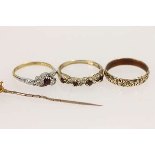 525 - Three yellow metal rings together with a 9ct gold hallmarked stick pin, gross 7.3g