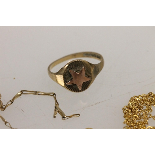 529 - 9ct gold ring together with three yellow metal chains, gross 5.9g