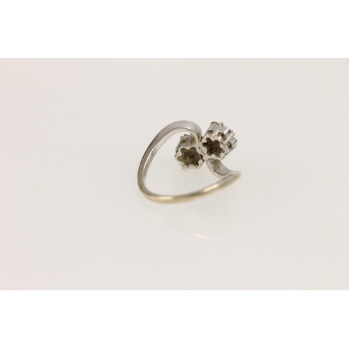 531 - 18ct white gold ring set with two diamond clusters in a daisy setting (missing two stones), size P/Q... 