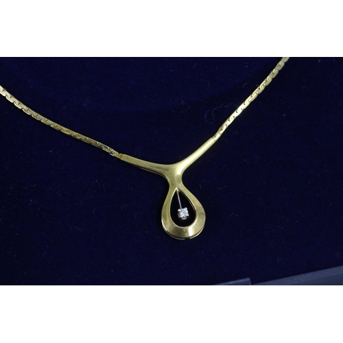 535 - 9ct gold modernist pendant and integral necklace set with small, suspended diamond in Ernest Jones r... 