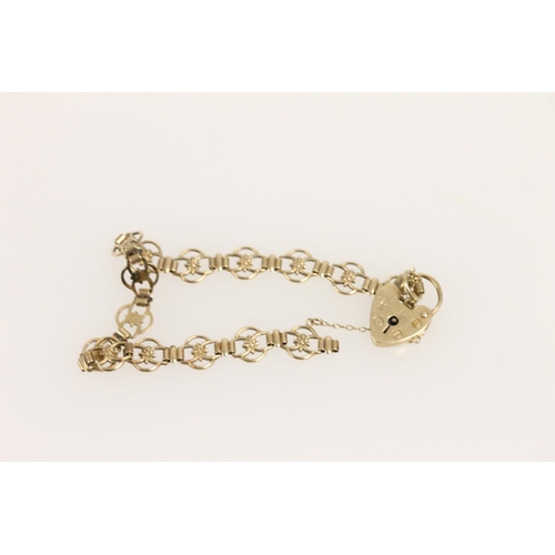 536 - Yellow metal fancy link bracelet with hallmarked 9ct gold heart shape clasp, gross 7.1g