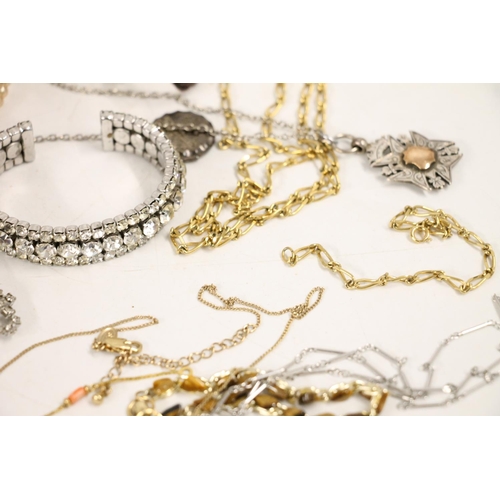 546 - Costume jewellery including a silver fob, silver locket, beaded necklaces etc.