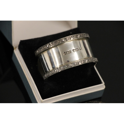 590 - Hallmarked silver napkin ring in Robert Stewart of Glasgow case, together with an art deco painted w... 