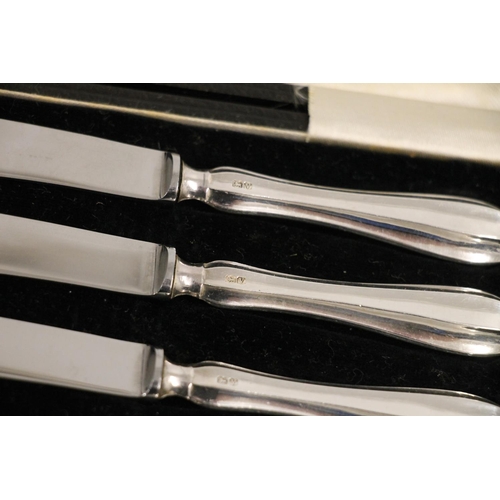 592 - Cased set of six silver handled butter knives, Sheffield 1938