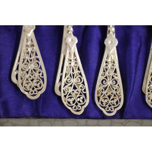 596 - Set of six silver teaspoons with twist stems and reticulated terminals, Sheffield 1899, 69g, togethe... 