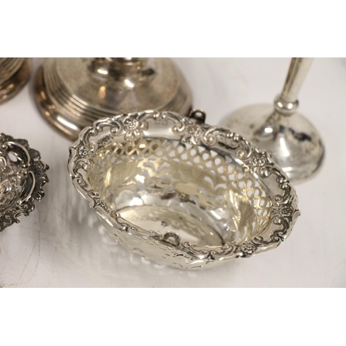 599 - Hallmarked silver items including two pairs of weighted candlesticks, two dressing table brushes, re... 