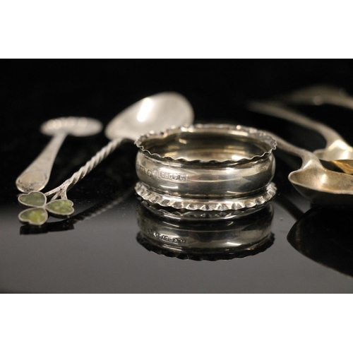 605 - Hallmarked silver teaspoons, a sugar spoon, and a napkin ring, 58g.