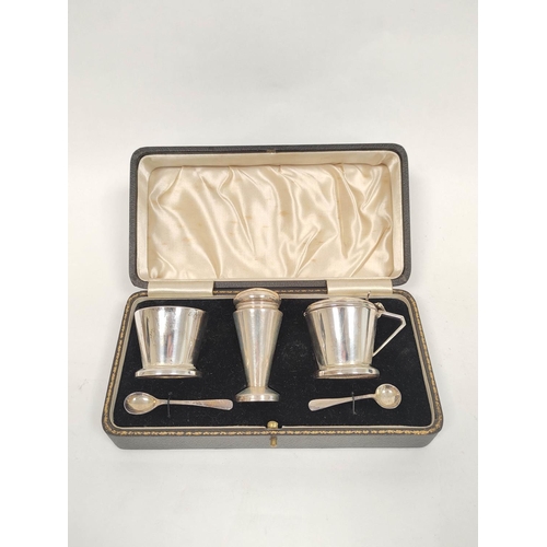 69 - Silver three piece condiment set of Art Deco plain, inverted conical shape, Birmingham 1939.