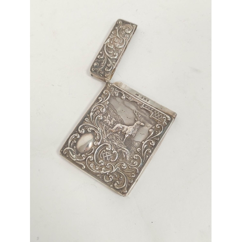 78 - Silver card case embossed with a stag amongst scrolls, Birmingham 1905.