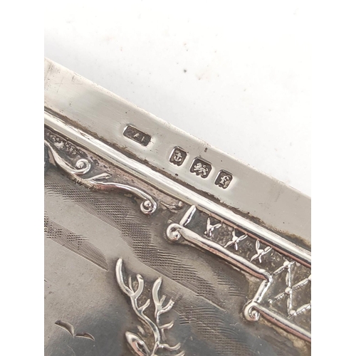 78 - Silver card case embossed with a stag amongst scrolls, Birmingham 1905.