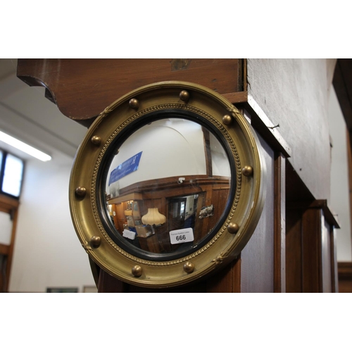 666 - Two porthole style wall mirrors.