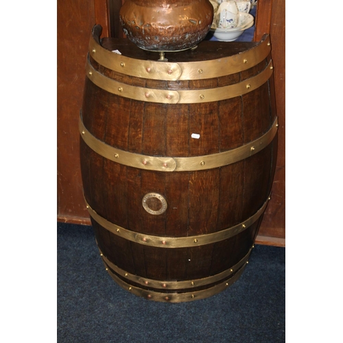 678 - Oak and brass bound half barrel, spigot marked William McEwan, Edinburgh 1960, 93cm high.