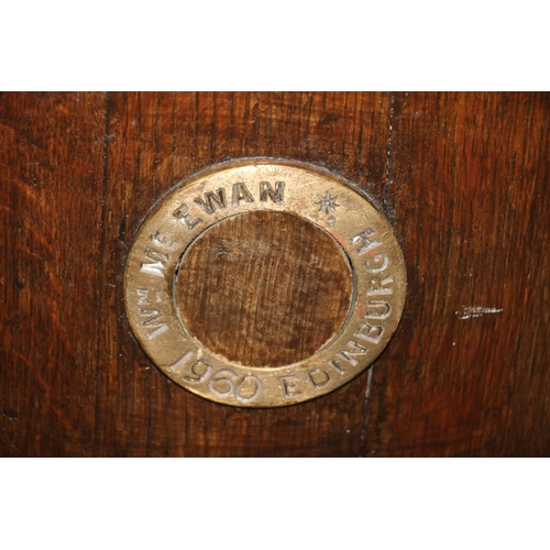 678 - Oak and brass bound half barrel, spigot marked William McEwan, Edinburgh 1960, 93cm high.