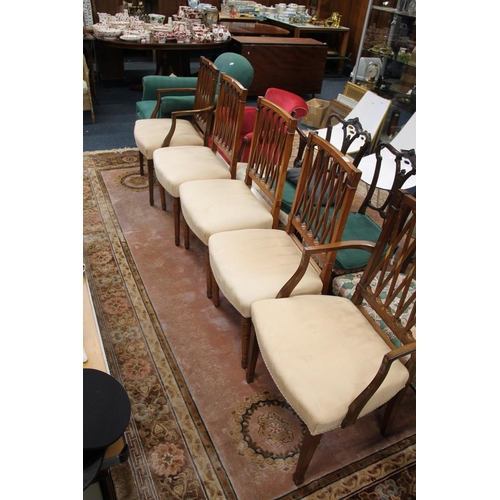 679 - Pair of Edwardian mahogany carvers with pierced trellis backs, and three matching dining chairs.