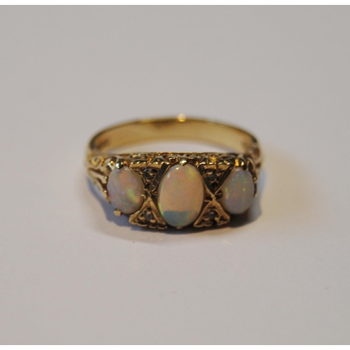 105 - Opal three-stone ring of Edwardian style with diamond chips, in 9ct gold, size N½, 4.3g gross... 