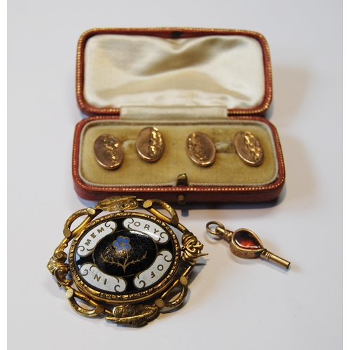 108 - Pair of 9ct gold cufflinks (2.6g), a gold gem-set watch key and a mourning brooch.