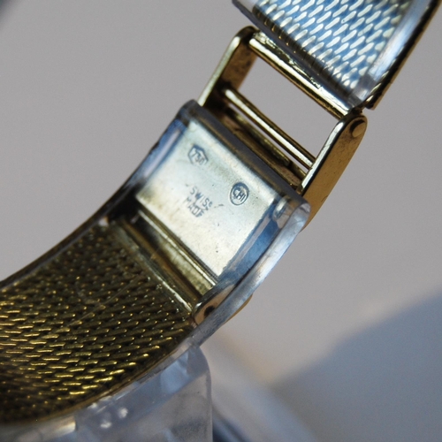 179 - Lady's Tissot 18ct gold watch with square dial, on integral Milanese bracelet, 41g including movemen... 