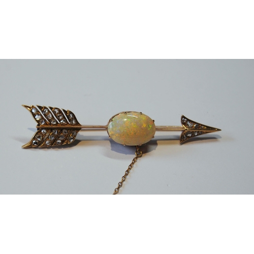 114 - Victorian gold arrow brooch with an opal (16mm x 11mm) and diamond points, probably 18ct gold, 65mm,... 