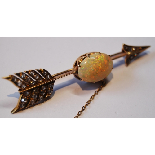 114 - Victorian gold arrow brooch with an opal (16mm x 11mm) and diamond points, probably 18ct gold, 65mm,... 