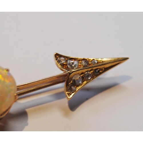 114 - Victorian gold arrow brooch with an opal (16mm x 11mm) and diamond points, probably 18ct gold, 65mm,... 