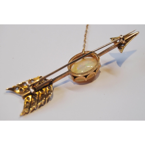 114 - Victorian gold arrow brooch with an opal (16mm x 11mm) and diamond points, probably 18ct gold, 65mm,... 