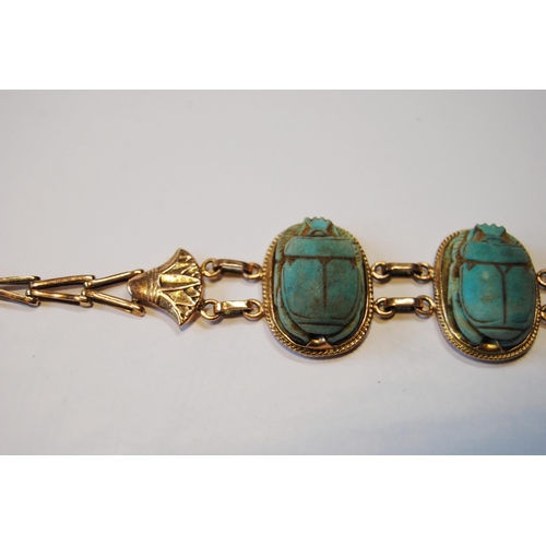 116 - Egyptian gold bracelet with three scarabs, probably 9ct, c. 1920.