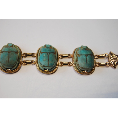 116 - Egyptian gold bracelet with three scarabs, probably 9ct, c. 1920.