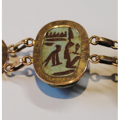 116 - Egyptian gold bracelet with three scarabs, probably 9ct, c. 1920.