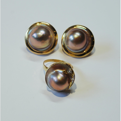 118 - Pair of mabe pearl ear clips and a similar ring with tiny diamonds, '14k'.