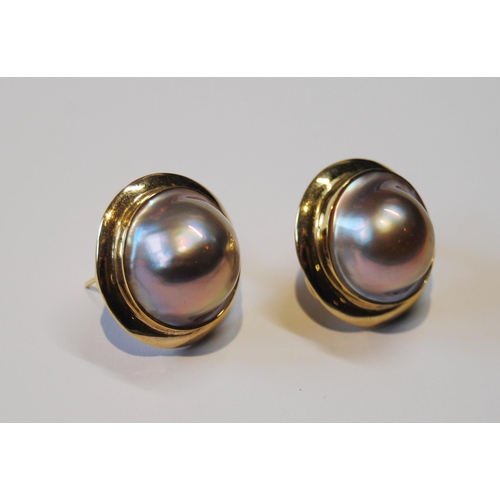 118 - Pair of mabe pearl ear clips and a similar ring with tiny diamonds, '14k'.