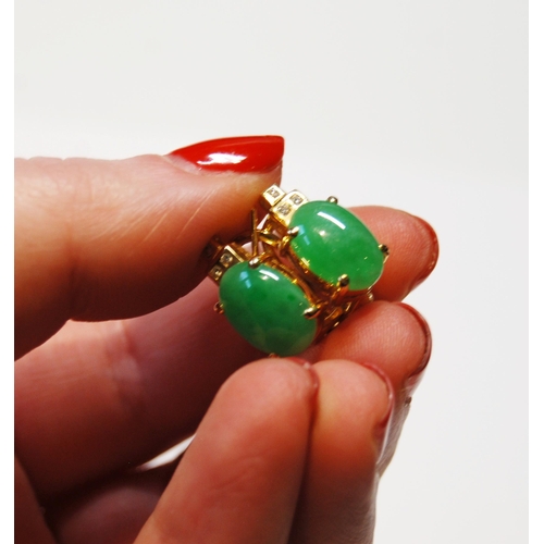 140 - Pair of jadeite ear clips, oval cabochons and tiny diamonds, in gold, '18k', 7.5g gross.