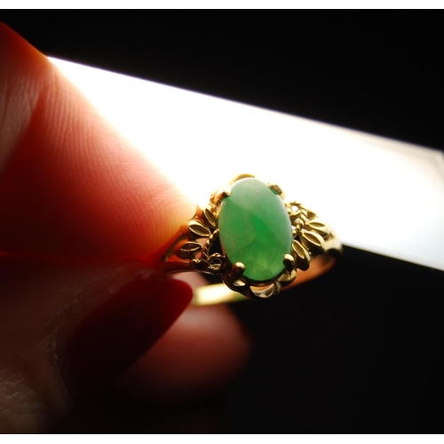 141 - Jadeite ring in gold, probably '18', size O.