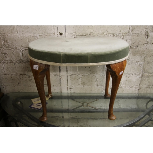 621 - Piano stool with kidney-shaped upholstered cushion, raised on cabriole legs, 42cm.