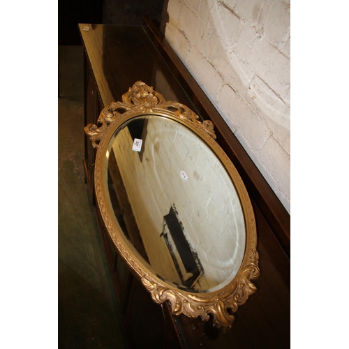 637 - Gilt framed mirror, 73cm high.