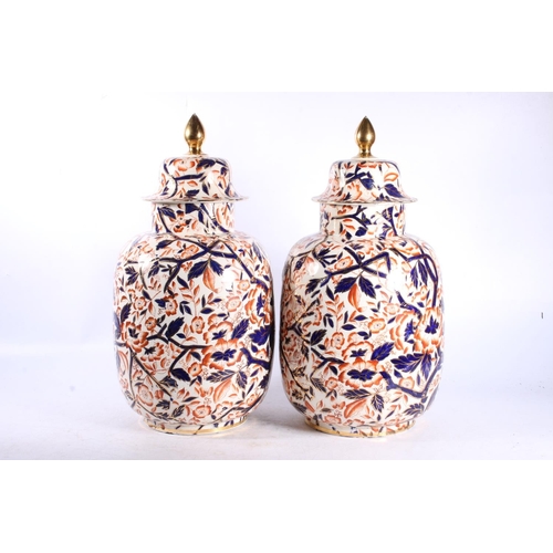 230 - Pair of late Victorian Staffordshire Imari palette pottery lidded urns, H38cm