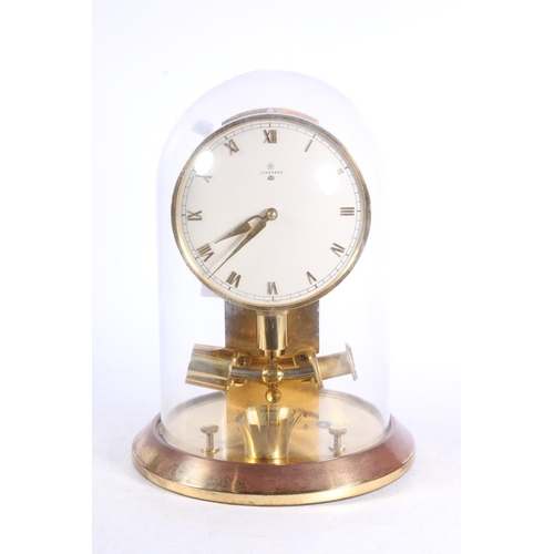 268 - Junghans brass mantel clock under glass dome, 27cm high.