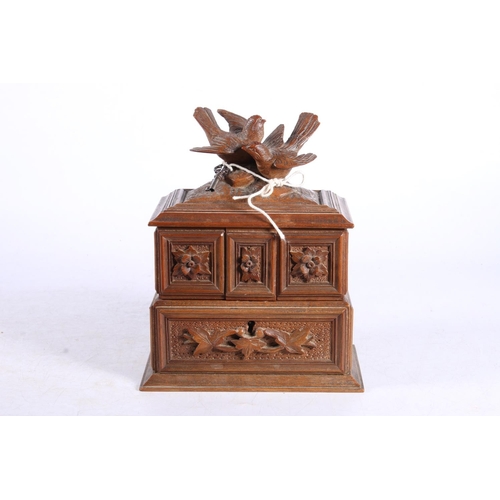 291 - Continental treen jewellery casket surmounted by a pair of lovebirds 19cm high,