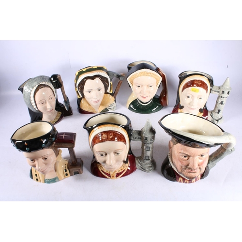 302 - Seven Royal  Doulton large character jugs depicting Henry VIII and his Six Wives.