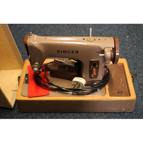 339 - Cased Singer sewing machine.