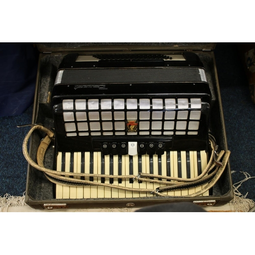 359 - Parrot black and white cased accordion.