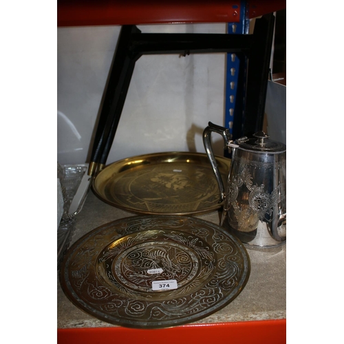 374 - Brass oriental tray on stand, a brass middle Eastern charger and a silver-plated teapot.