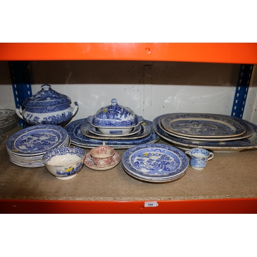 398 - Blue and white Willow pattern, and other, serving trays, tureen and covers, plates, etc.